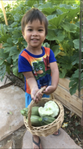 AJ Displaying His Squash Harvest_